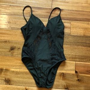 Green one piece bathing suit with net/lace